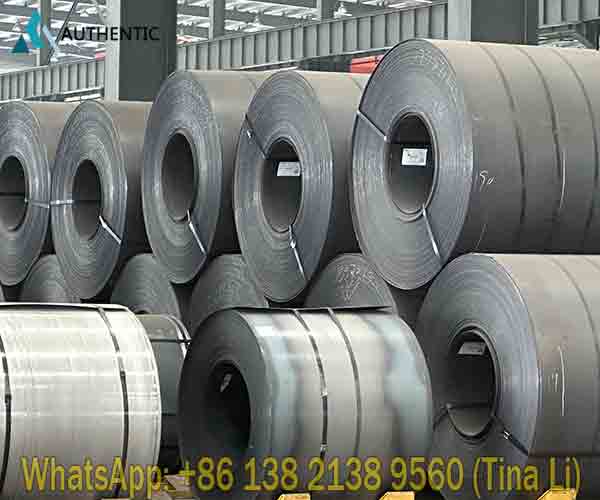 A massive indoor warehouse filled with premium hot rolled steel coil inventory to guarantee immediate wholesale supply for international B2B buyers.