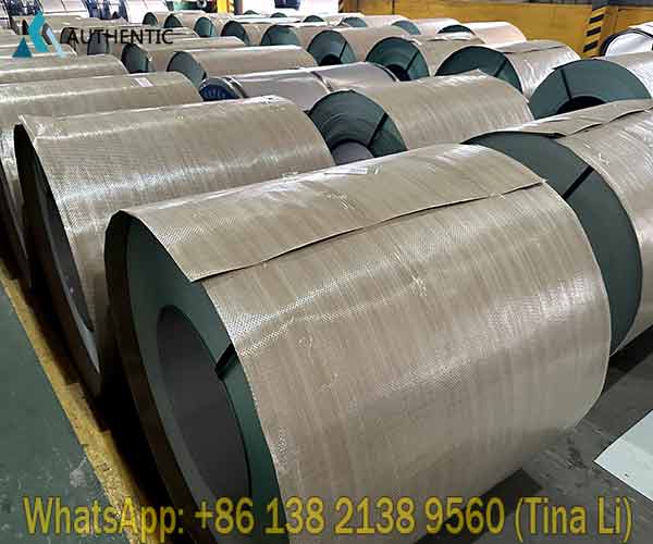 A professional stack of seaworthy packed PPGI steel coils secured with steel straps and edge protectors, ready for transoceanic maritime transit from Authentic Steel.