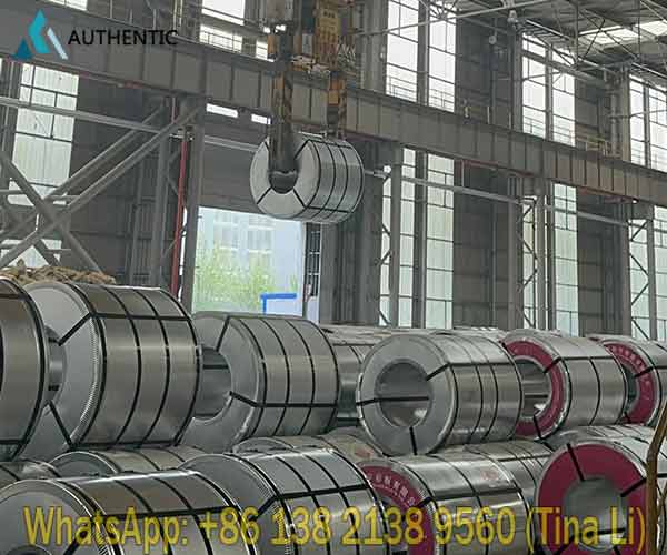 Heavy-duty seaworthy packed wood grain printed PPGI steel coils bound with metal straps for safe and convenient ocean transport.