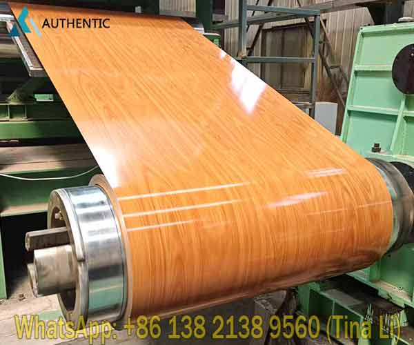Advanced printing production line applying realistic timber texture onto wood grain printed PPGI steel coil at high speed.